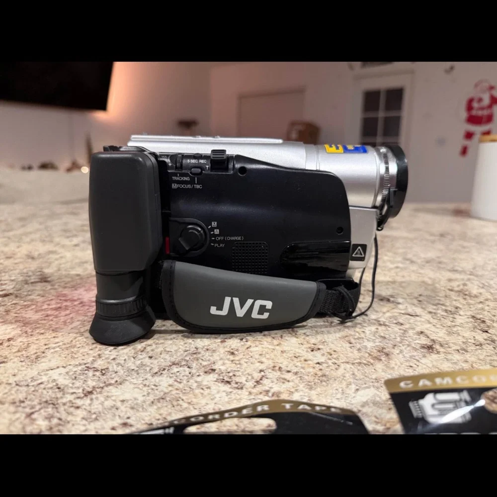 JVC Gray Camcorder with VHS-C Tapes